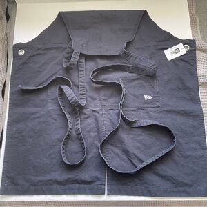 New Era black cotton apron. One size fits most. NWT